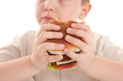 Boy eating burger Boy eating burger