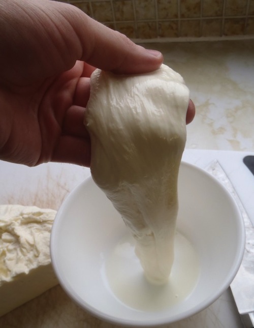 stretching mozzarella stretching mozzarella