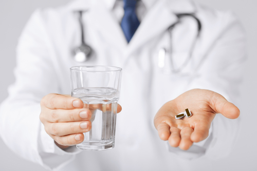 doctor handing out pills doctor handing out pills